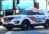 Mall Massacre Plot Stopped Cold Police SUV with lights on in an urban environment