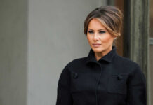 Melania’s Gambit Sparks Global Debate Melania Trump in black coat.