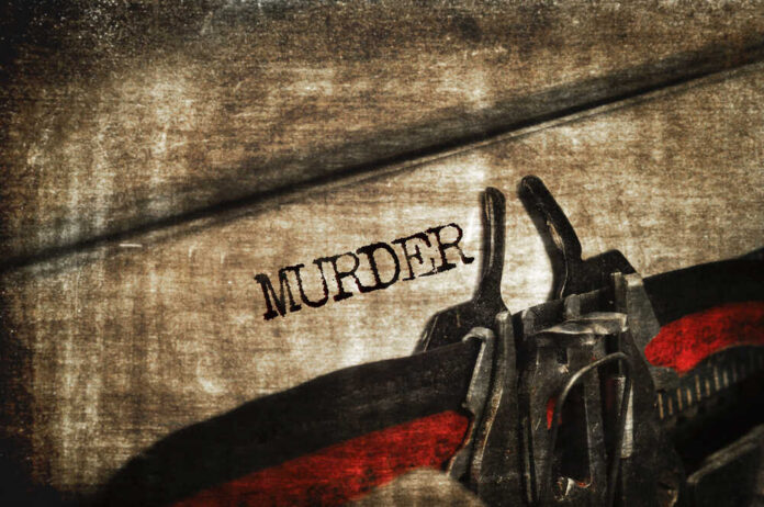 Word,Murder,Written,With,An,Old,Typewriter Close-up of metal handcuffs on a grungy surface with the word MURDER