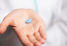 Viagra Cousin’s Weird Twist Cancer cells spreading on a blue surface.