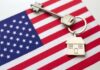 BAD NEWS: Mortgage Shock Slams Buyers House key with keychain on American flag