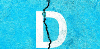 White letter D on cracked blue surface.