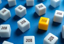Jobs Stall, Forecasts Shattered A yellow cube with the word 'JOB' surrounded by white cubes with the same word on a blue background
