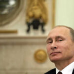 Russia Diesel Gambit Ignites Fury Vladimir Putin in suit smiling.
