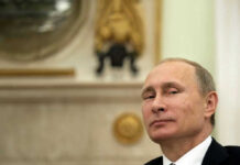 Russia Diesel Gambit Ignites Fury Vladimir Putin in suit smiling.