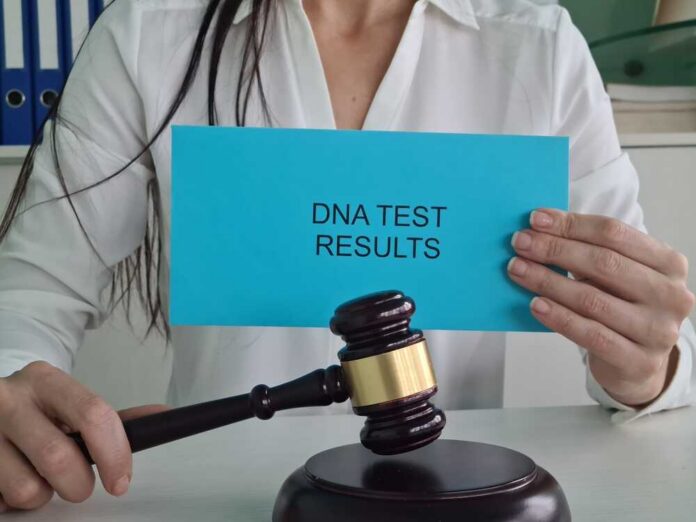Woman,Holding,Dna,Test,Results,In,Front,Of,Gavel