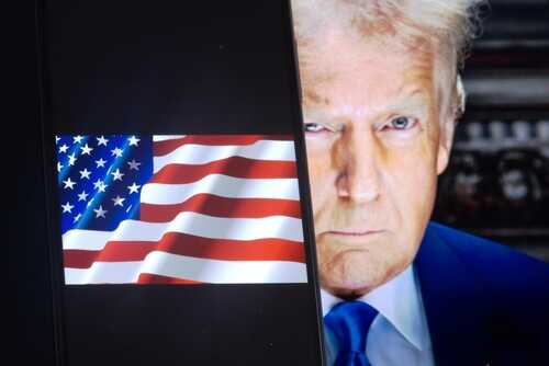 Donald Trump face beside a display of the American flag