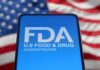 FDA Alarm – Deadly Weight-Loss Shots FDA logo displayed on a smartphone with an American flag background