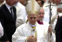 Pope’s Health Jolt: Surgery Imminent Catholic bishop in white vestments holding a crosier