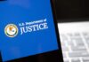 DOJ Targets TV ‘Boycott’ – Antitrust Bomb? U.S. Department of Justice logo on a smartphone screen