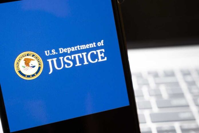 Warsaw,,Poland,-,Feb,26,,2026:,Image,Of,The,U.s. U.S. Department of Justice logo on a smartphone screen