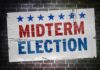 Midterm election poster on a brick wall