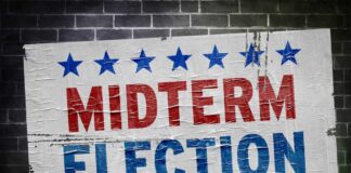 Midterm election poster on a brick wall